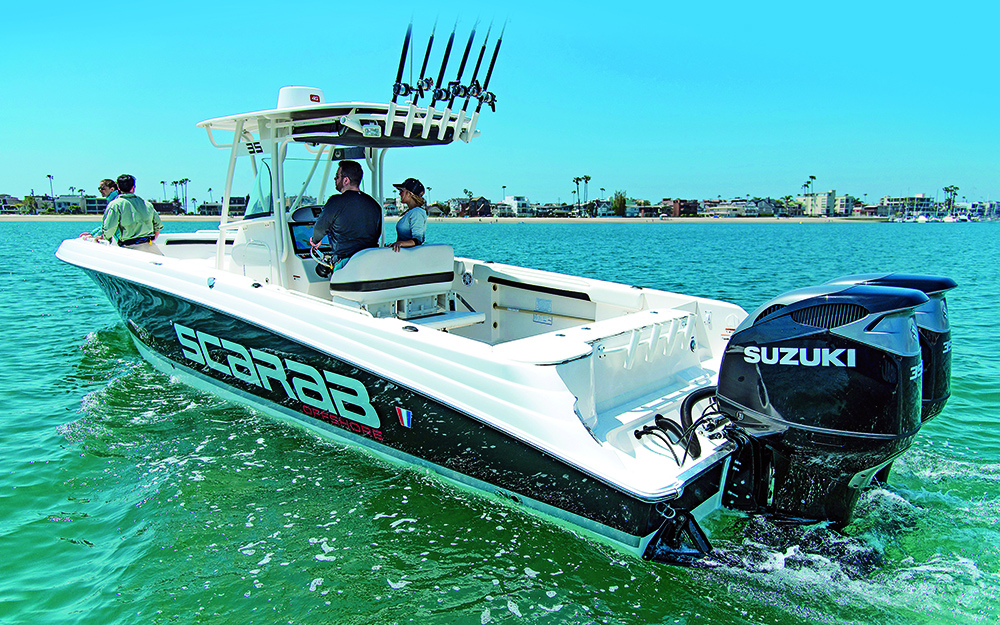Scarab fishing boat with twin Suzuki outboards on the transom