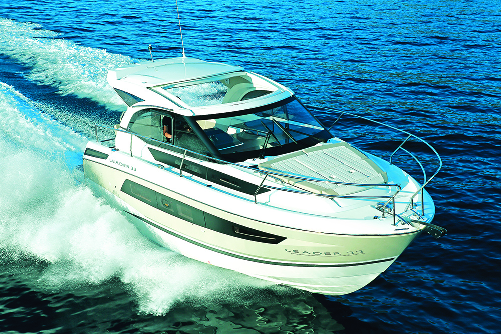 Jeanneau Leader 33 on blue sea aerial view