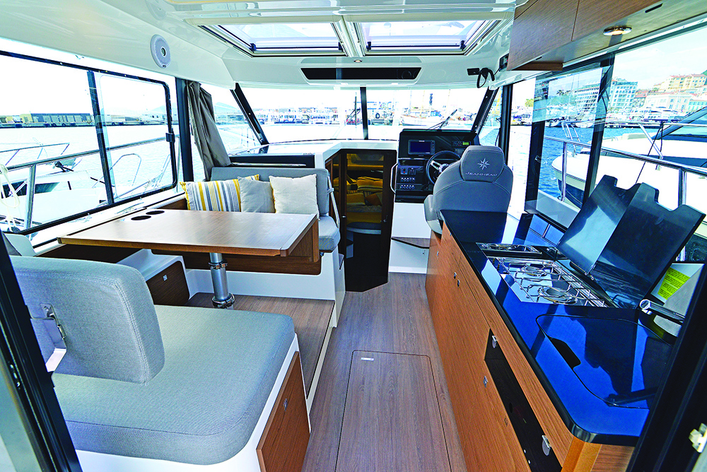 Merry Fisher 1095 saloon showing seating and table and galley