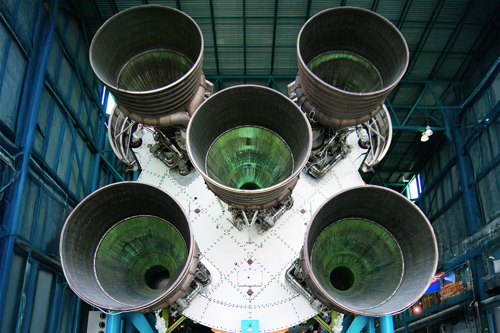 Rocket engines on launch vehicle, illustrating extreme decibel levels compared with ocean noise impacting marine life