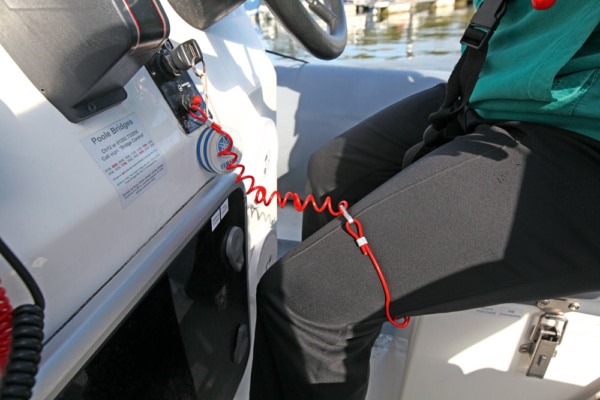 Boat engine kill cord correctly fitted around the drivers leg