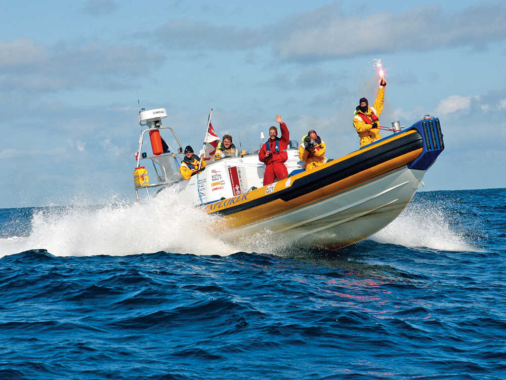 Bear Grylls and crew waving aboard their cross atlantic RIB