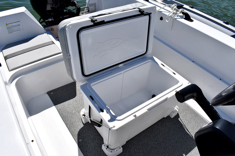 A sealed coolbox forms the helms seat. Although nifty, being secured with bungee cords means the box will tip when leant against. 