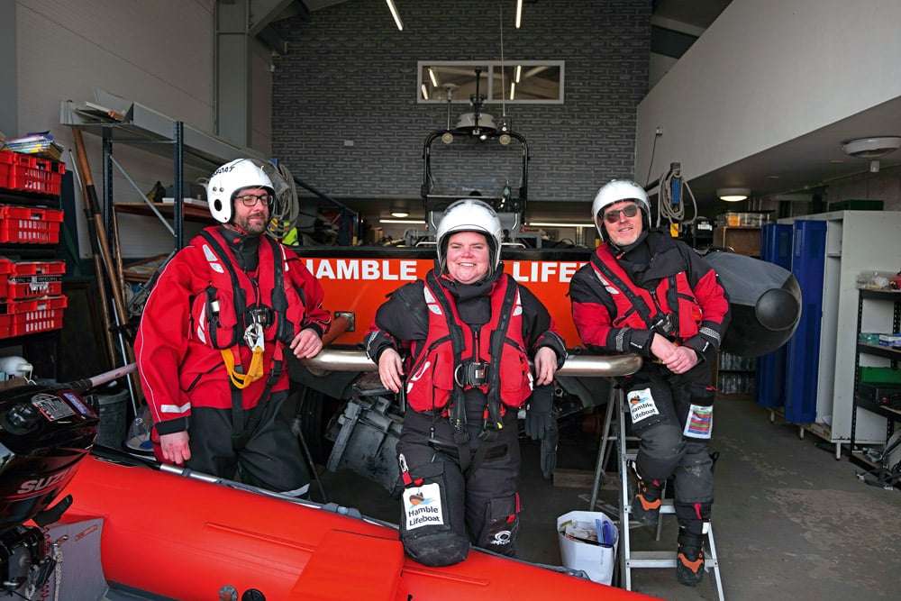 Crew members (from left) Ian Allen, Kate Dunlop and Mark Lewis in front of the “Harry Childs” lifeboat, now undergoing sea trials after an extensive re-fit.