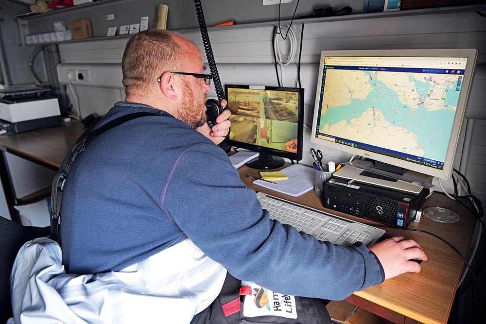 Crew member Alan Rackett on radio watch at the Hamble Lifeboat station.