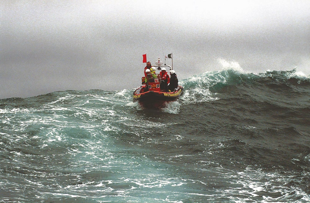 This Tornado outboard RIB with its crew of five shows immense stability amid the heavy seas. Note the relaxed nature of this RNLI lifeboat team taking part in the event.