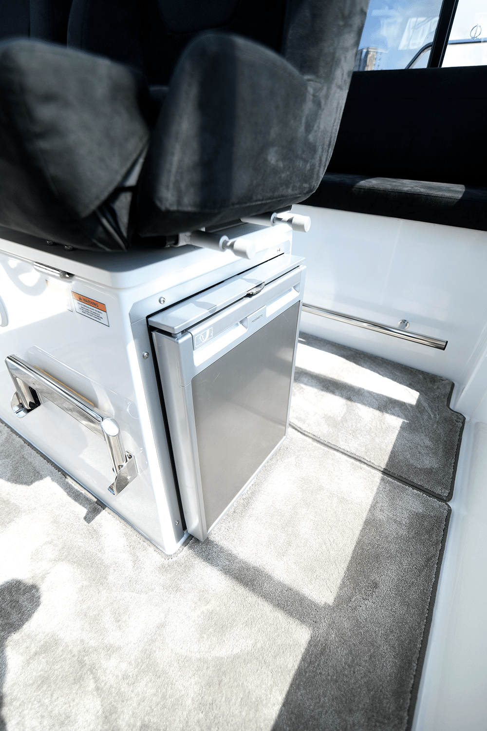 A 50L fridge sits under the navigator’s seat.