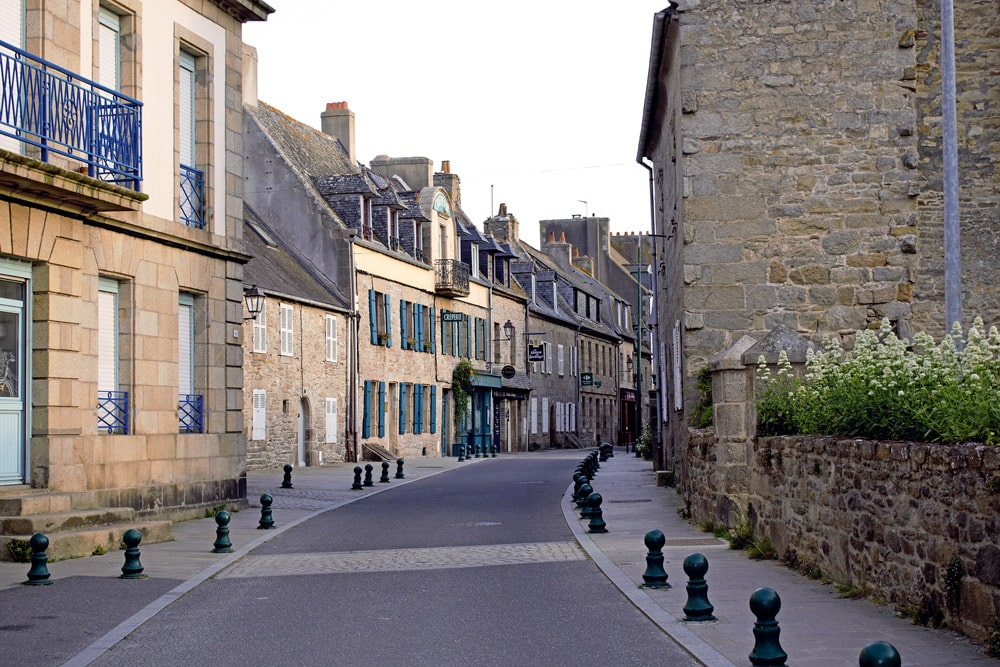 Pretty boulevards lined with granite medieval houses Inset: The region is famous for growing artichokes.