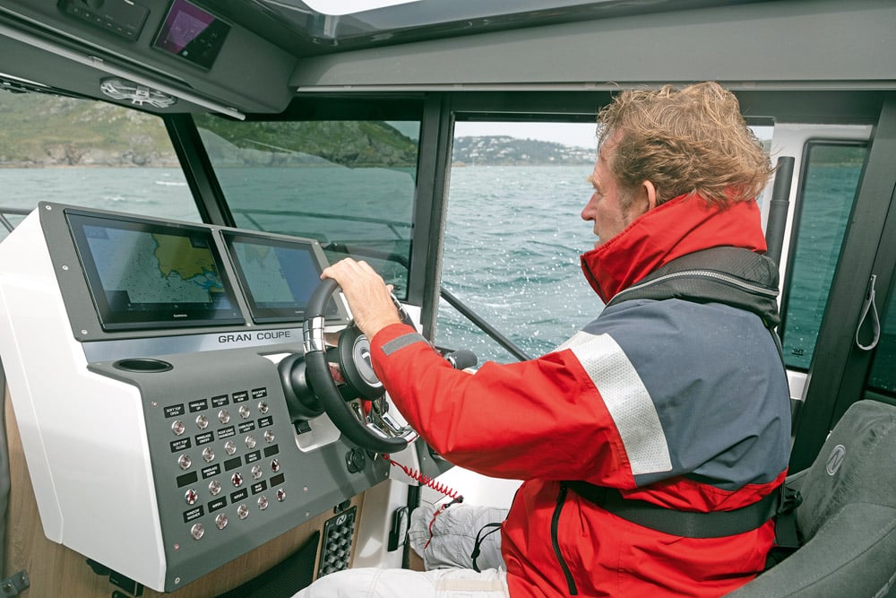 Editor, Hugo Montgomery-Swan, at the helm of the Nordkapp 905 V12. View of driving console with all instrumentation.