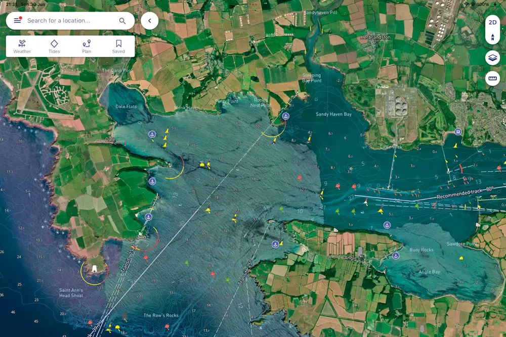 Satellite chart overlay displaying tidal streams, depths and hazards for coastal navigation planning.