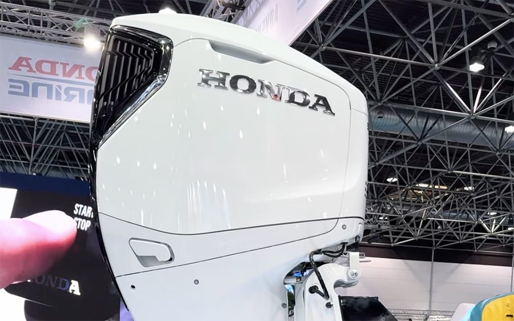 Honda 300hp outboard on turntable standing upright rotating at Boot Dusseldrof boat show