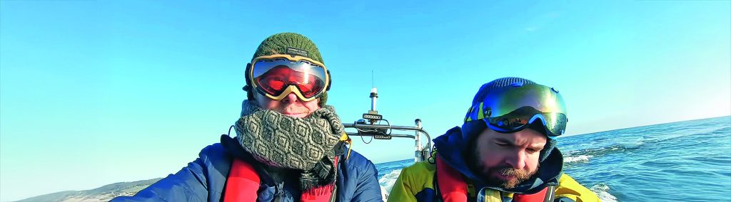 Crew wrapped up in cold-weather gear aboard Goodwin