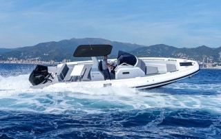 white Sacs Technorib boat underway at sea