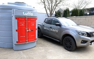 New 6,000 litre Hydrotreated Vegetable Oil tank next to Williams Jet Tenders company Nissan truck at the Oxfordshire headquarters.