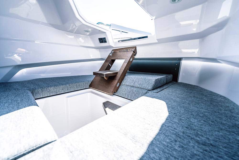 Axopar 29 - The multi cabin steps can fold flat to create an infill section for the bed. 