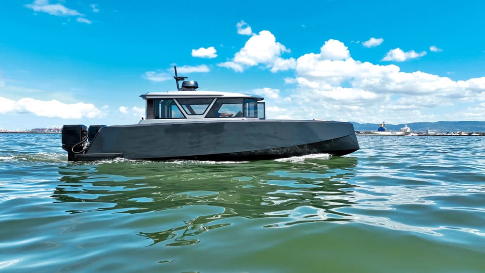 The Navier N30 with foils deployed starting to transit from displacement to foiling speed.