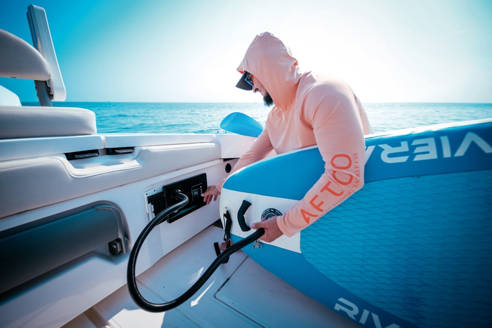 At the push of a button, ATMOS air pump is ready to inflate paddleboards and towable toys in quick time from Scanstrut. paddleboard pump