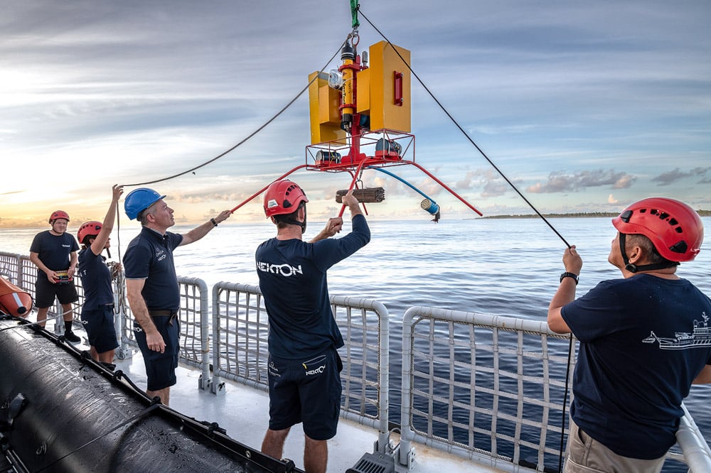 Scientists and crew aboard a research vessel prepare to drop bait cameras off the coast of the Maldives as part of a science mission to map, sample and gather data on ocean health.