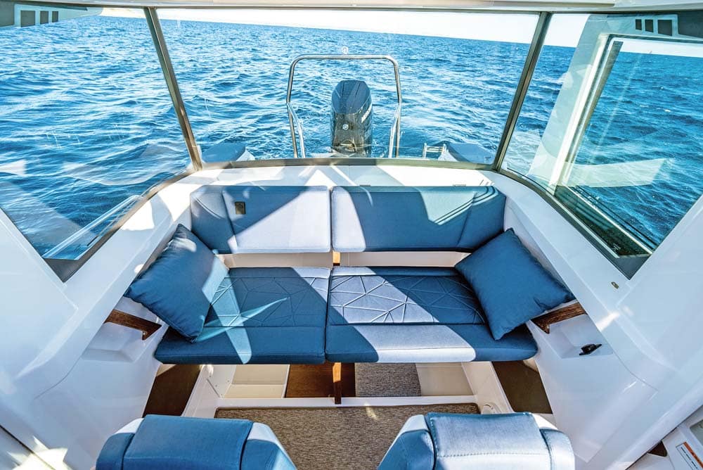 Axopar 29 - Seating for three behind the helm seats in the XC.