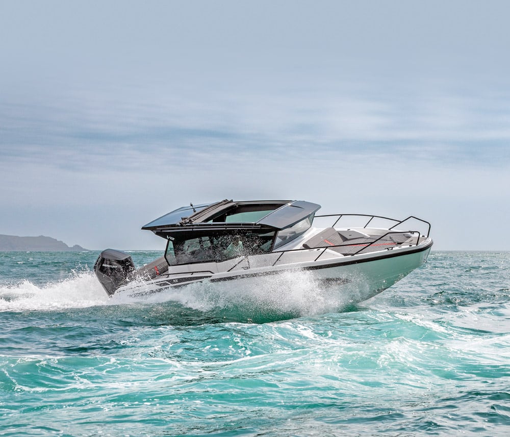 Nordkapp Gran Coupe 905 V12 underway on beautiful turquoise sea