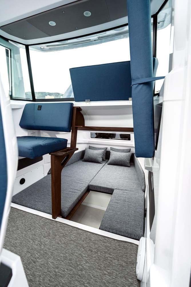 Axopar 29 - Forward access to the aft cabin requires the back seat to be folded up. 