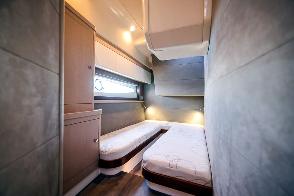Full standing headroom at the foot of the beds on the starboard side.