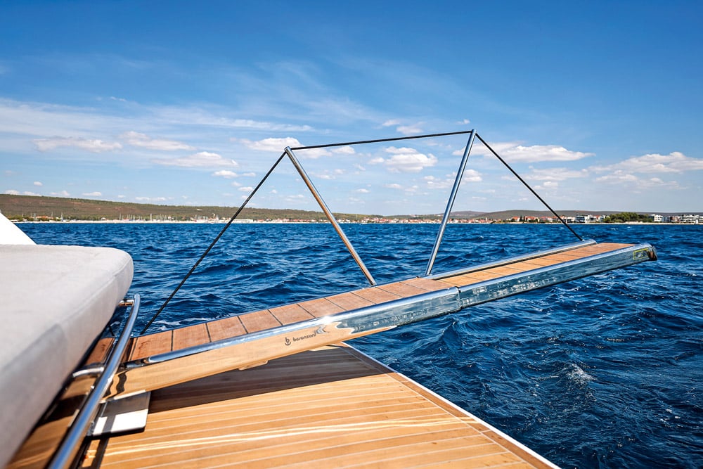 A passerelle is located under the sunbed. 