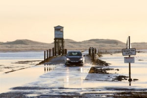 car on flooded road