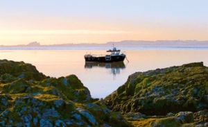 Boat on water sunset