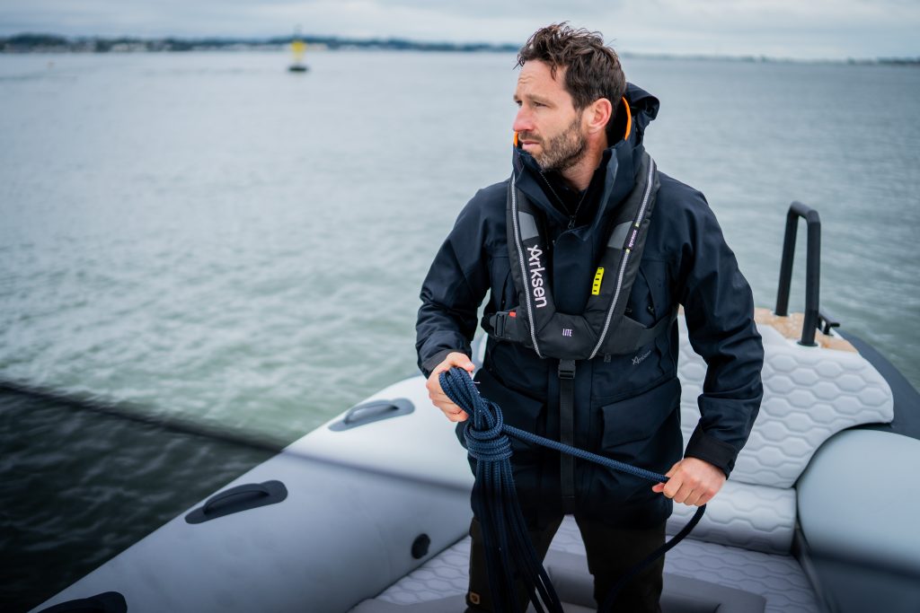 Man in boat wear Arkset clothing