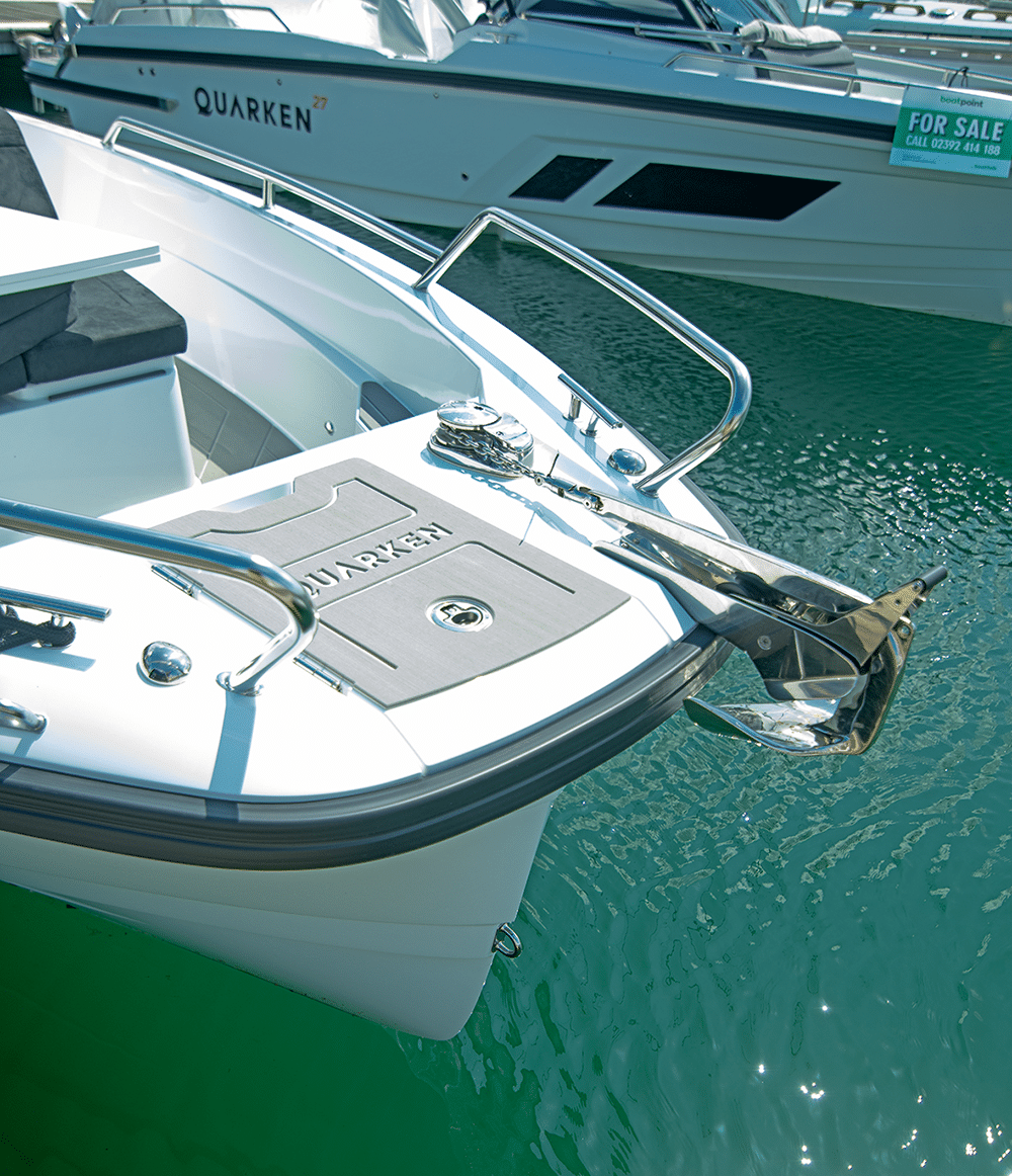 The side deck has tall bulwarks for a 27-footer.