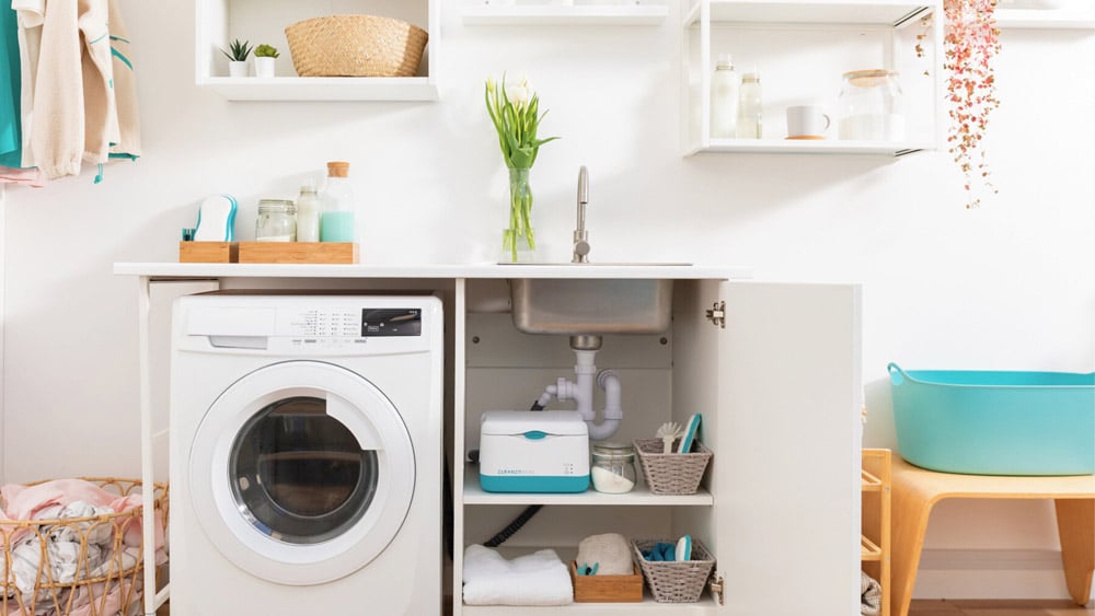Cleaner Seas Group Indi microfibre filter unit attached to a domestic washing machine. Photo – Cleaner Seas Group
