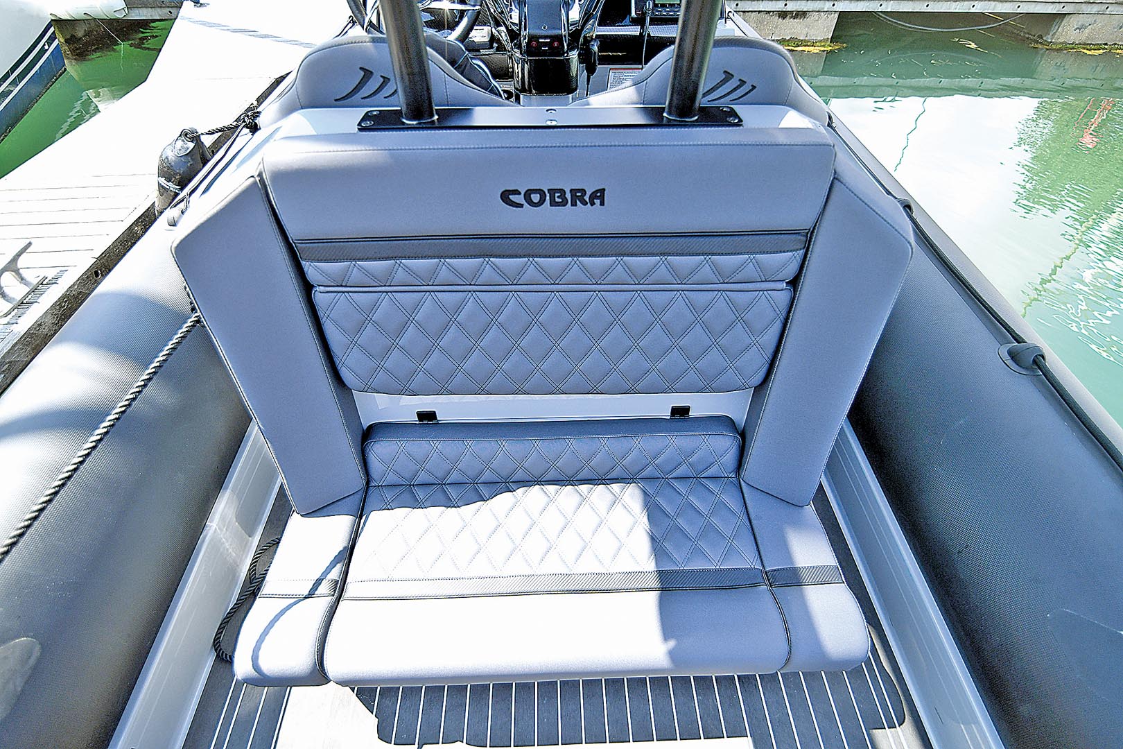 The aft-facing sofa has secure storage compartments behind.