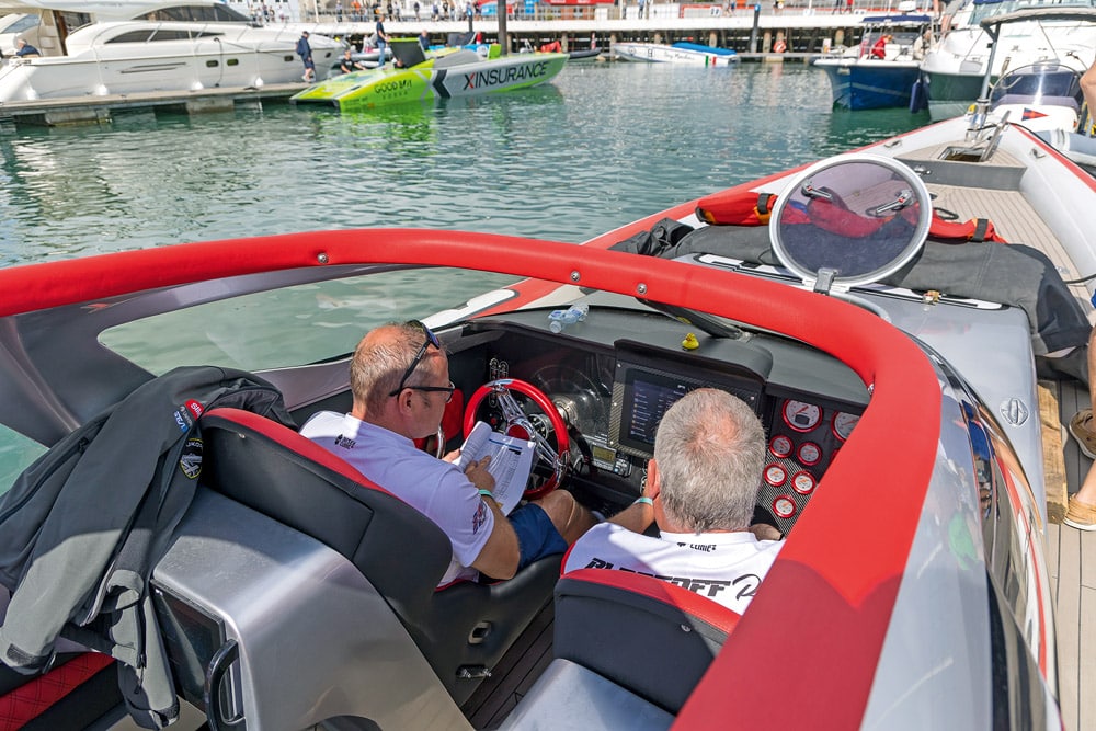 Chart plotting and race preparation. Cowes–Torquay–Cowes offshore powerboat race