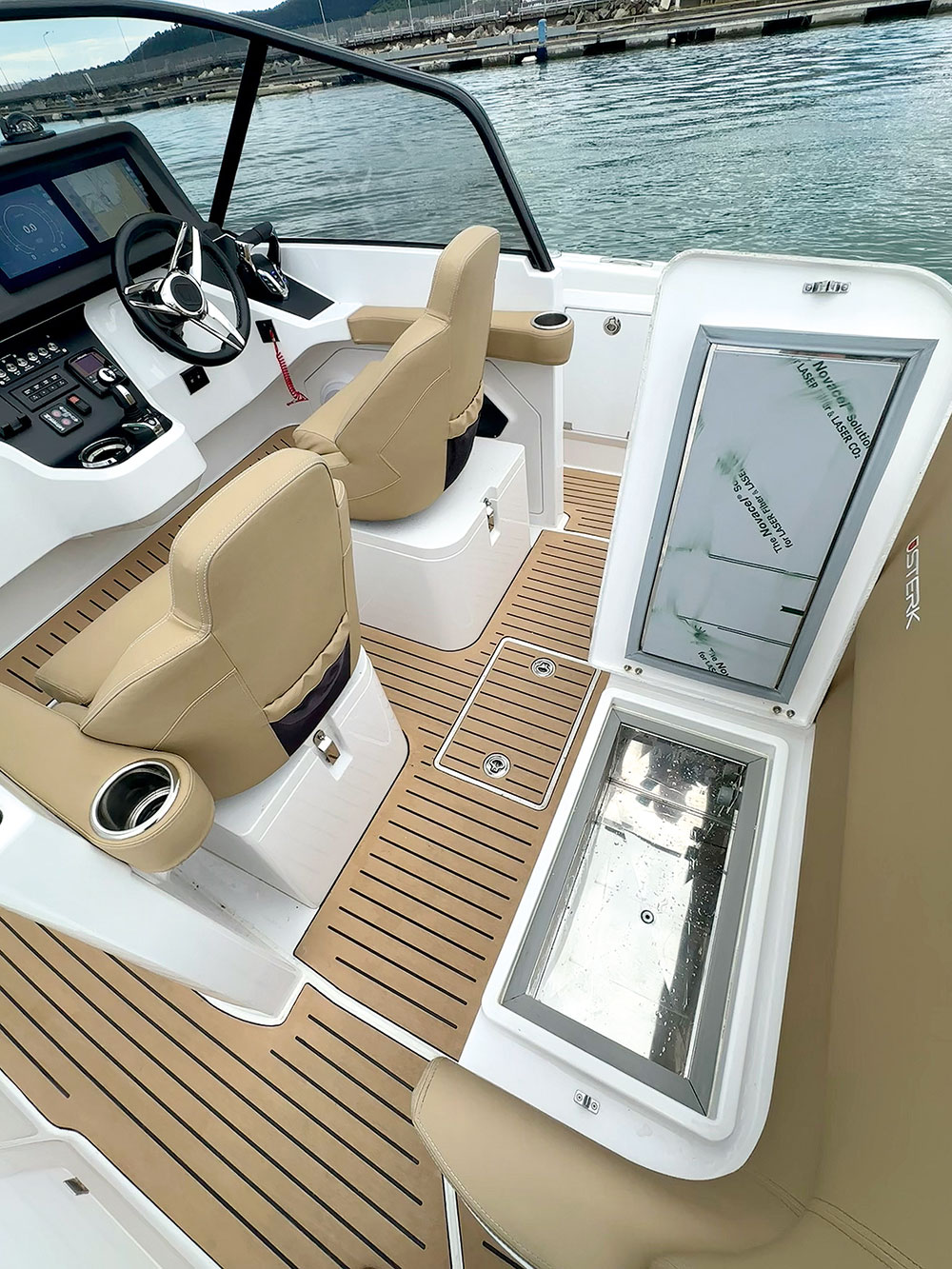 Sterk 31RC. Great fridge and freezer space under the bench seat. German sports boat