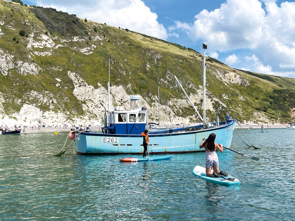 Paddleboarders enjoying the calm waters and fine weather.