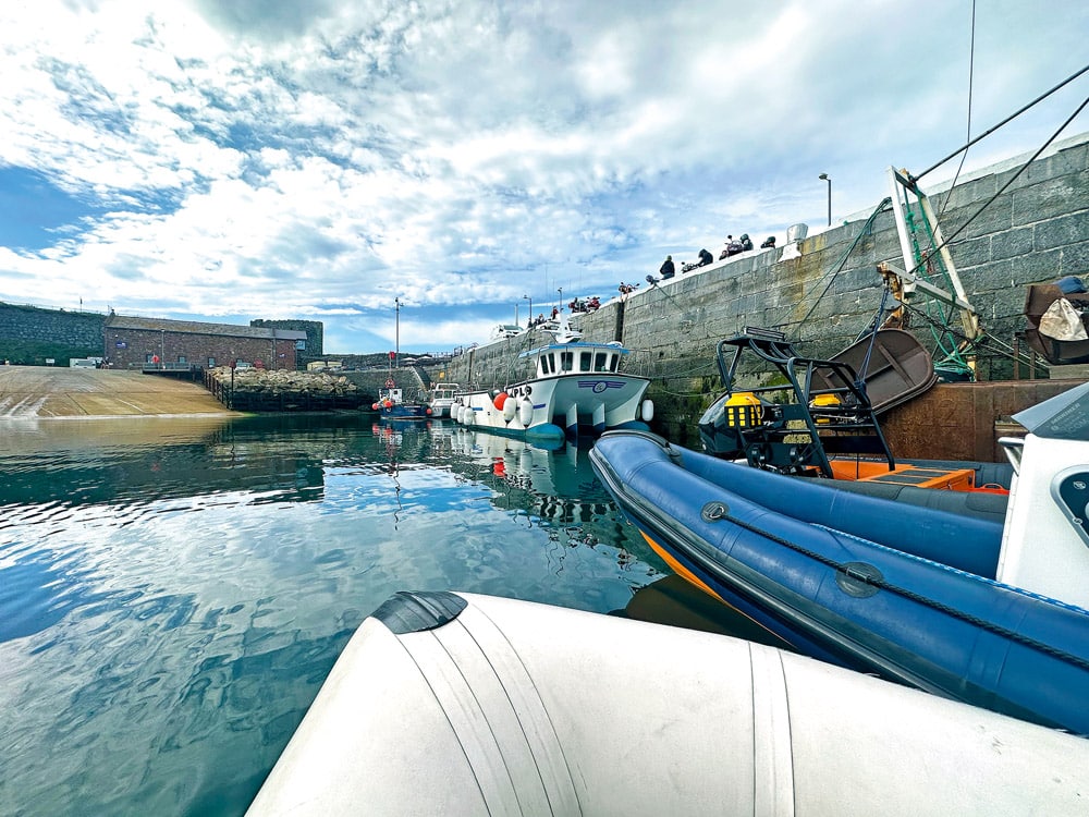 Rafted up to make way for a local fishing boat. Isle of Man Boating Adventure