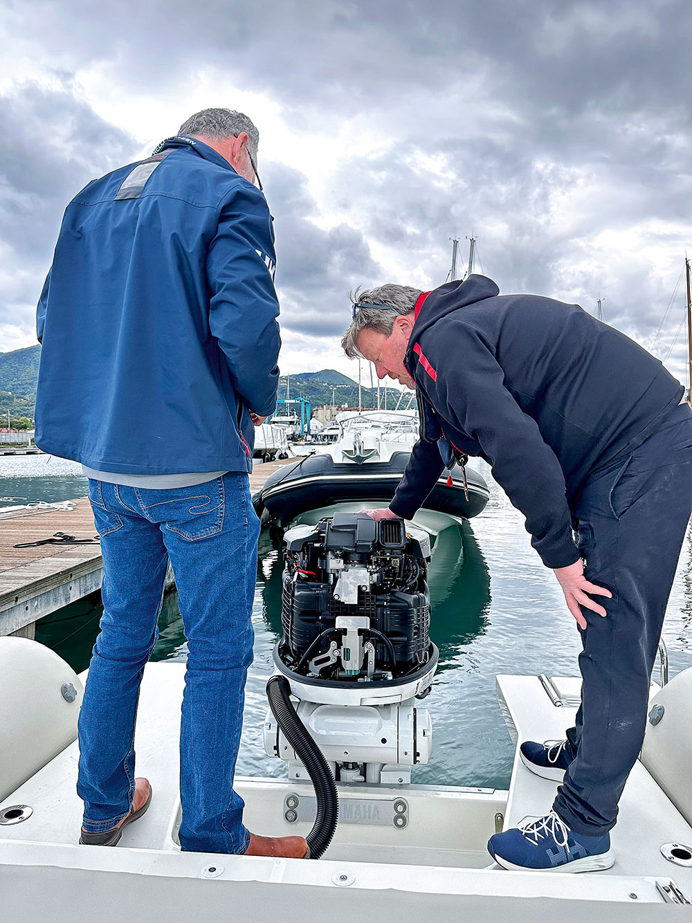 Men inspecting at Yamaha 350hp