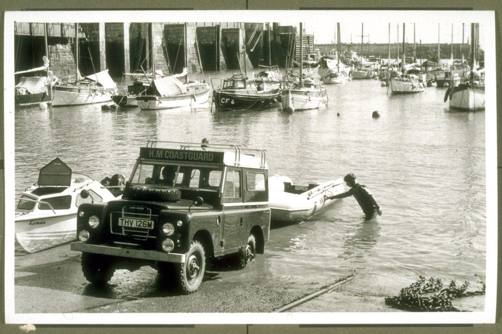 Barry Dock inshore lifeboat being lauched off back of H M Coastguard Land Rover