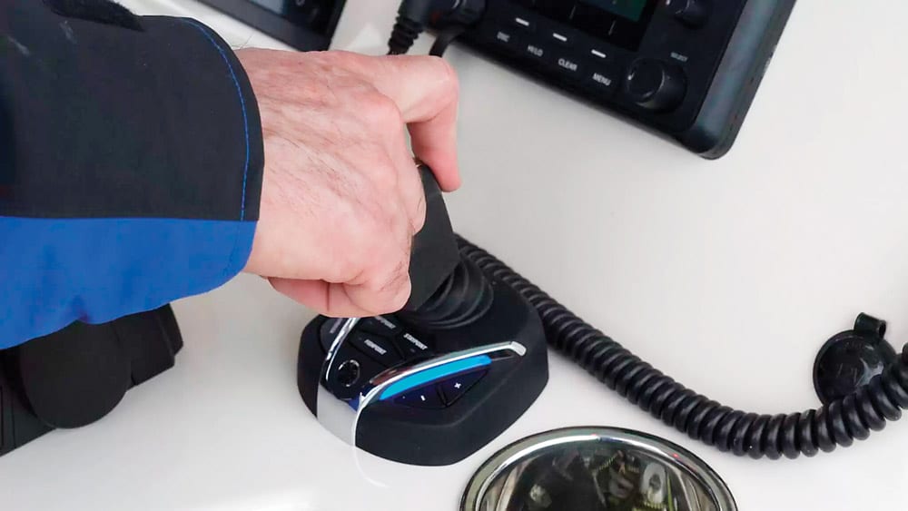 Operator using joystick to adjust rearward scaled