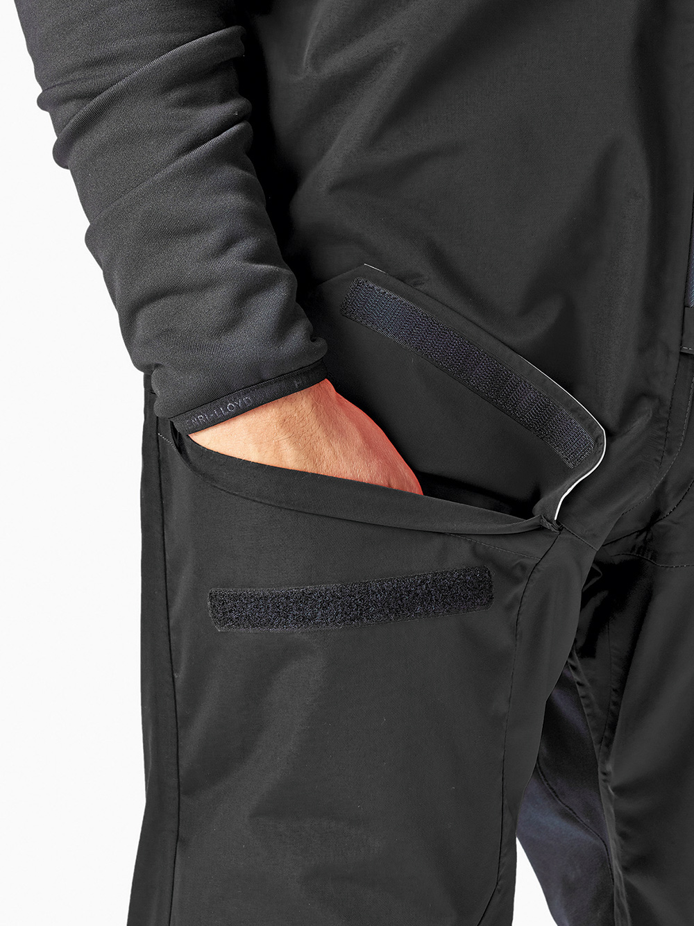 Pockets feature envelope closures and drainage holes.