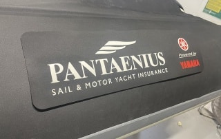 Pantaenius' logo with Yamaha branding displayed on the side of the 7.5m RIB by Island RIBs.