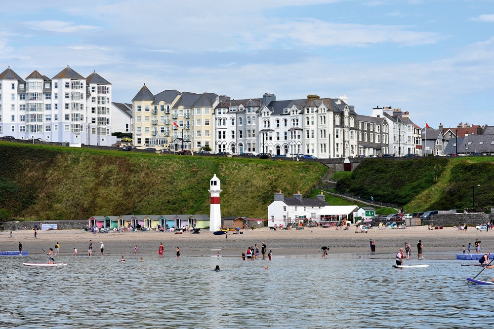 Busy Port Erin, with families enjoying the water.