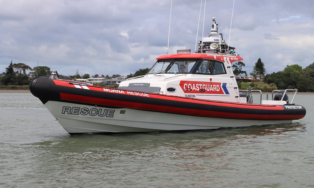 A modern Coastguard rescue RIB is seen on calm waters.