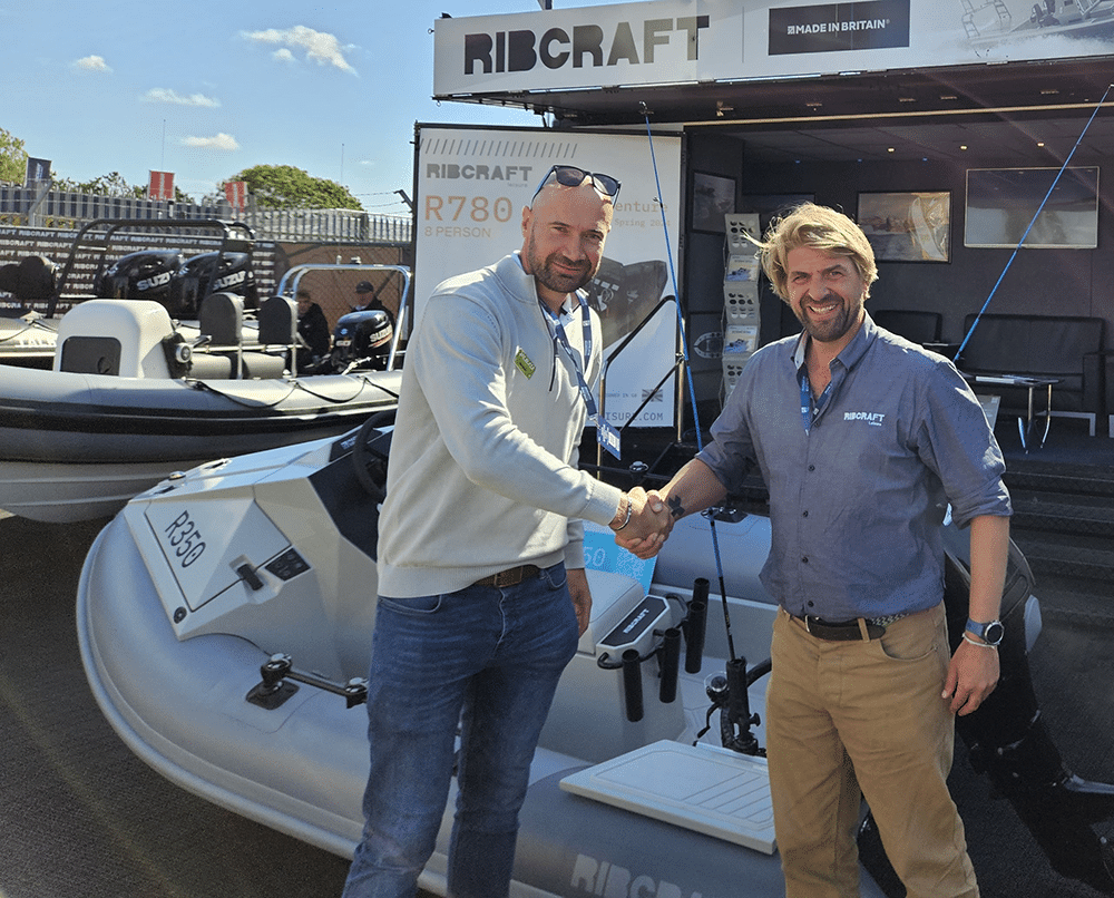 Nick Edgington (left), Sales Director for RAILBLAZA, congratulates Olly Stevens (right), Global Sales Manager for Ribcraft, on the launch of the new Ribcraft 350 Adventure RIB.