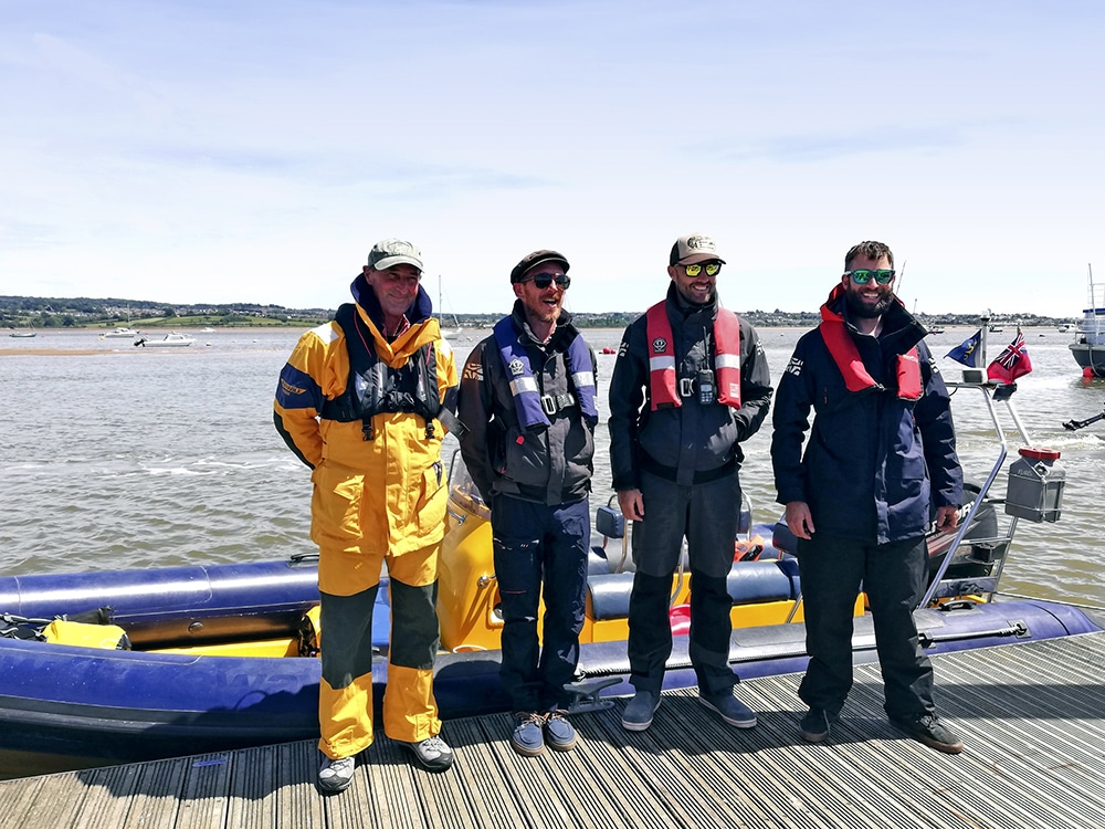 Crew members standing with their 2019 Solent RIB 6.5 before starting and adventure.