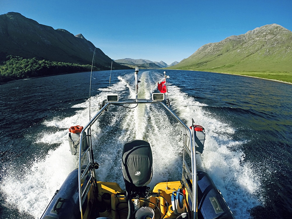 Steep mountains as a RIB travels along the Crinan Canal in Scotland
