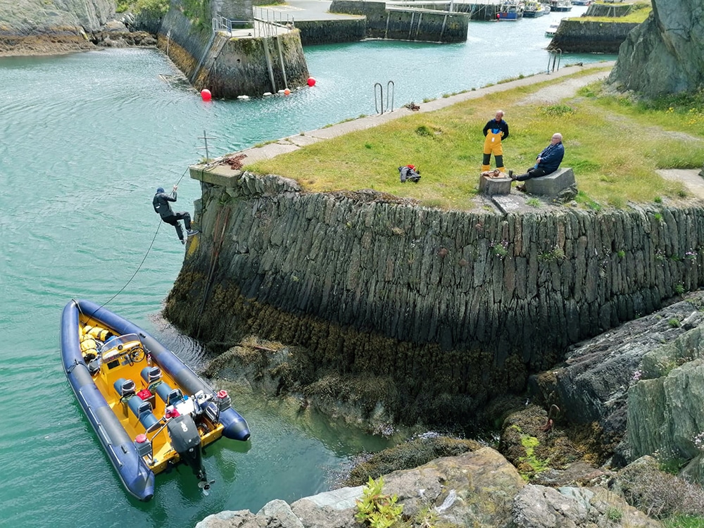 RIB at rest in a harbour, while the crew take a break on dry land.