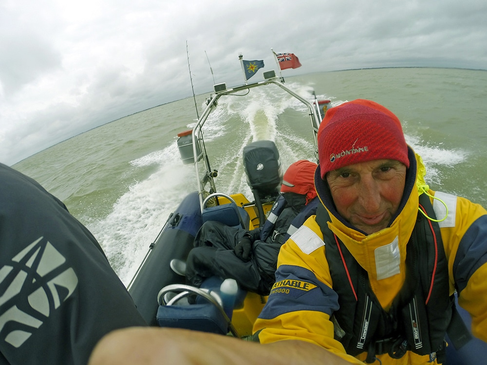 A crew member having a rest onboard a 6.5m RIB travelling around Great Britain.