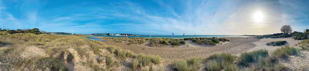 Studland Bay and harbour panorama © iStock-pilesasmiles